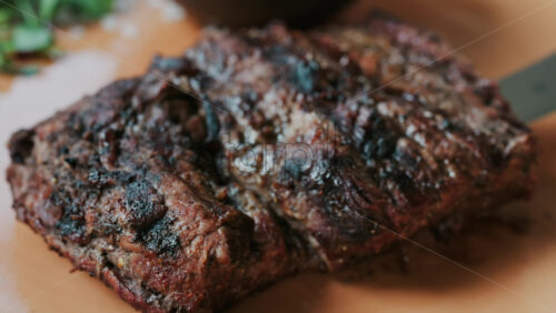 Close up of a Sirloin Steak with Barbecue Sauce and micro-plants on the side - Starpik Stock