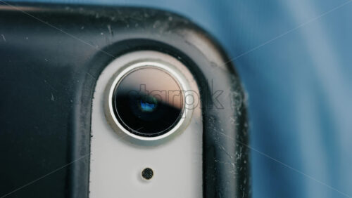 Close up of a smartphone camera lens with scratches on the case - Starpik Stock