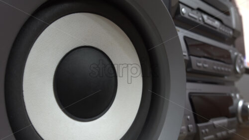 Close up of a speaker of a big, grey boombox - Starpik Stock