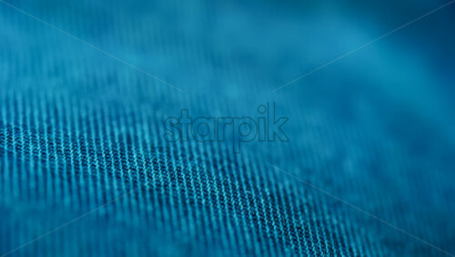 Close up of blue fabric texture showing fine threads and detailed textile pattern - Starpik Stock