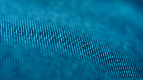 Close up of blue fabric texture showing fine threads and detailed textile pattern - Starpik Stock