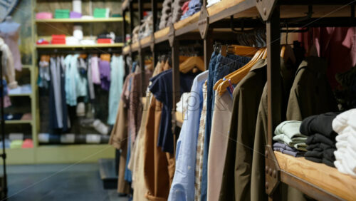 Close up of multiple clothes hanging on a rack in a store - Starpik Stock