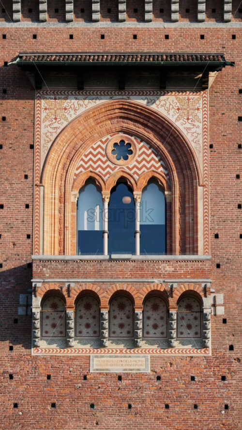 Close up of the Filarete Tower in Milan, Italy. Vertical - Starpik Stock
