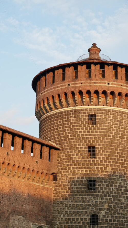 Close up of the Sforzesco Castle over a blue sky in daylight. Vertical - Starpik Stock