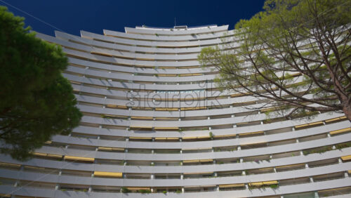 Close up of the white, large, pyramid-shaped building in the Marina Baie des Anges complex in Villeneuve-Loubet, France - Starpik Stock