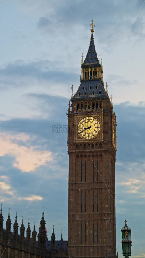 Close-up view of Big Ben illuminated at dusk in London, England. Vertical - Starpik Stock