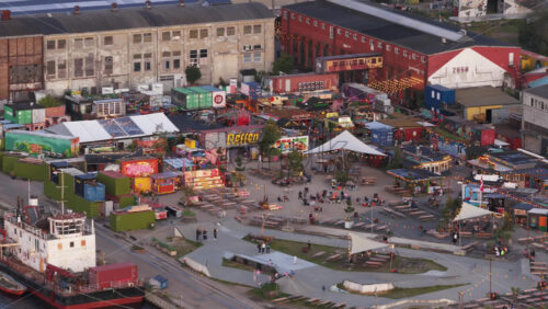 Copenhagen, Denmark – August 3, 2025: Aerial drone view of Reffen, vibrant street food market made of colourful containers - Starpik Stock