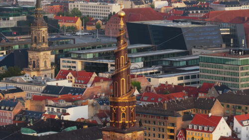 Copenhagen, Denmark – August 3, 2025: Aerial drone view of the iconic spiral tower of the Church of Our Saviour in Copenhagen, Denmark - Starpik Stock