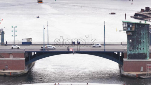 Copenhagen, Denmark – August 4, 2025: Aerial drone view of Islands Brygge harbor bath and Langebro Bridge in daylight - Starpik Stock