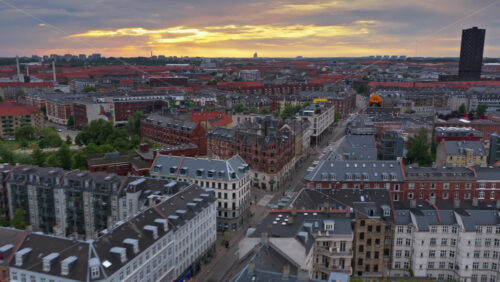 Copenhagen, Denmark – August 4, 2025: Aerial drone view of Norrebrogade, one of the busiest streets in Norrebro, looking towards the city center skyline - Starpik Stock