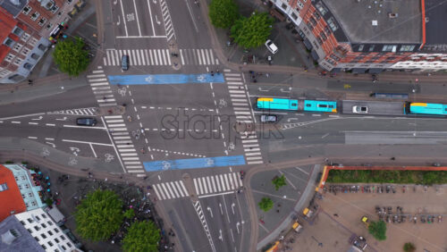 Copenhagen, Denmark – August 4, 2025: Aerial drone view of Norrebrogade, one of the busiest streets in Norrebro looking towards the city center skyline - Starpik Stock