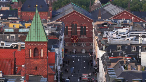 Copenhagen, Denmark – August 4, 2025: Aerial drone view of Sankt Matthaeus Kirke and Tivoli Congress Hall in Vesterbro - Starpik Stock