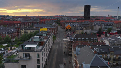 Copenhagen, Denmark – August 4, 2025: Aerial drone view of of Norrebro, with a straight street leading to the distinct Bispebjerg Tower in the distance - Starpik Stock