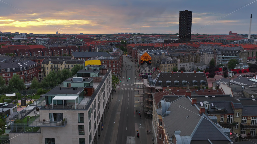Copenhagen, Denmark – August 4, 2025: Aerial drone view of of Norrebro, with a straight street leading to the distinct Bispebjerg Tower in the distance - Starpik Stock
