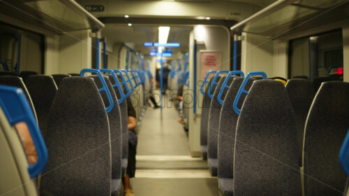 Empty seats on a train moving through London, England - Starpik Stock
