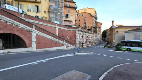 Grasse, France – August 10, 2025: Traditional colourful buildings and sloped streets in the old town of the city - Starpik Stock