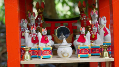 Kyoto, Japan – April 11, 2025: Small, white Kitsune Figurines at the Arashiyama Bamboo Forest in Kyoto, Japan - Starpik Stock