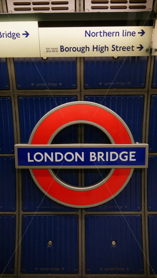 London, England – May 12, 2025: Close up of the iconic London Bridge Underground station sign. Vertical - Starpik Stock