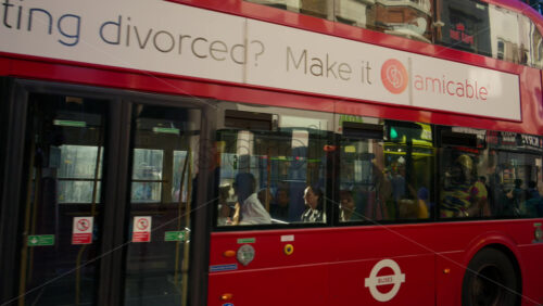 London, England – May 13, 2025: Red double-decker bus passing through the financial district of the city near Liverpool station - Starpik Stock