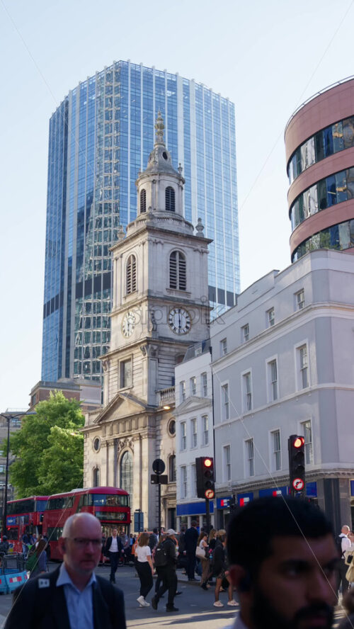 London, England – May 13, 2025: St. Botolph-without-Bishopsgate church standing prominently at the edge of Liverpool Street. Vertical - Starpik Stock