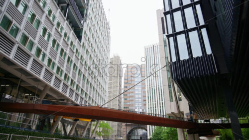 London, England – May 14, 2025: Low angle view of modern office buildings in London Wall financial district - Starpik Stock