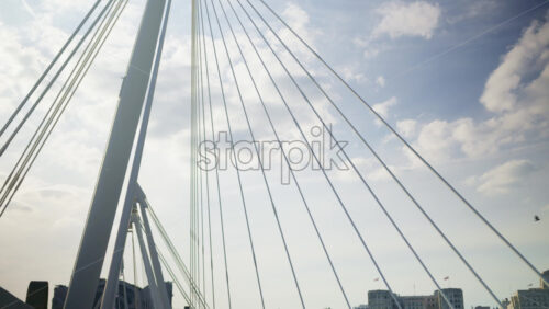 London, England – May 14, 2025: People walking across the Golden Jubilee Bridge over the Thames - Starpik Stock