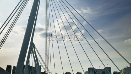 London, England – May 14, 2025: Time lapse of people walking across the Golden Jubilee Bridge over the Thames - Starpik Stock