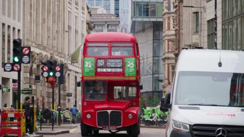 London, England – May 15, 2025: Classic red double-decker bus out of service on a London street during the day, near business district - Starpik Stock