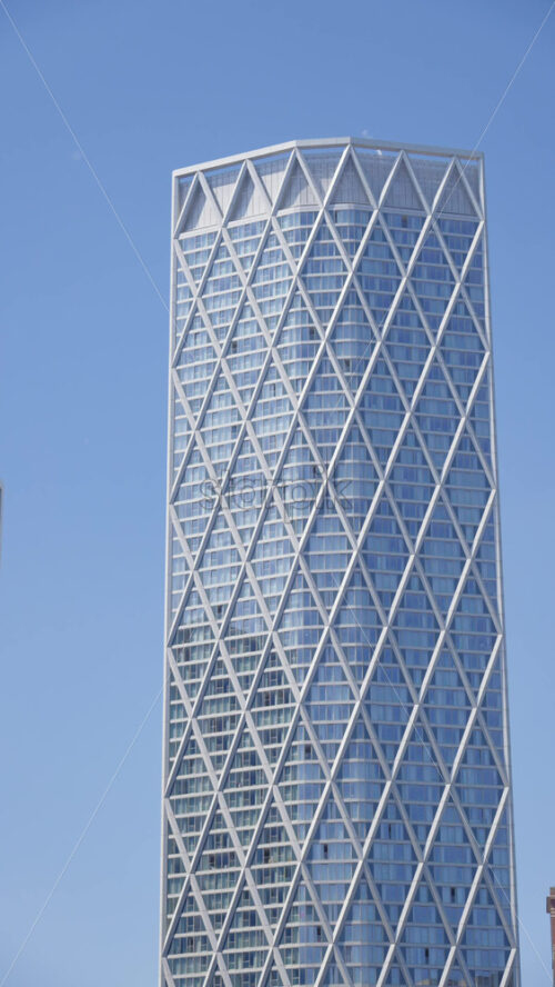 London, England – May 15, 2025: View of a modern glass office buildings in the skyline of the city. Vertical - Starpik Stock