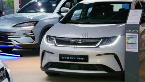 London, England – May 16, 2025: Close-up of the front of a sleek, grey BYD Dolphin electric car displayed indoors - Starpik Stock