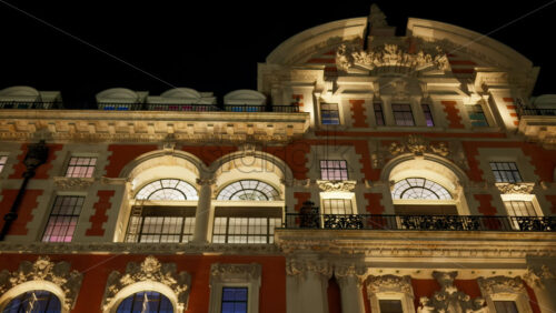 Low-angle view of a grand historical building in London, England with cloudy skies in the background in the evening - Starpik Stock