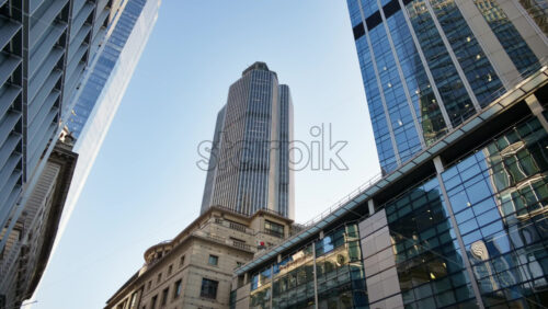Low angle view of modern glass skyscrapers in the heart of London’s financial district - Starpik Stock