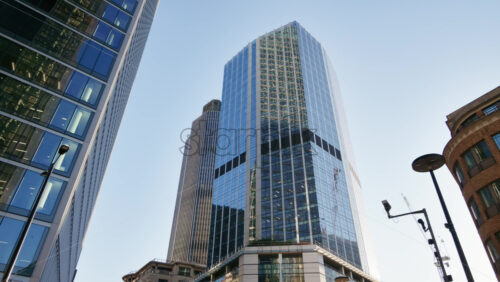 Low angle view of modern glass skyscrapers in the heart of London’s financial district - Starpik Stock