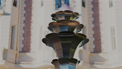 Metal Sculpture with a blurred background of a building in the south of France - Starpik Stock