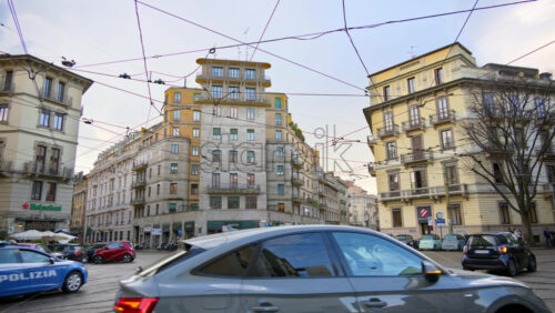 Milan, Italy – March 20, 2025: Cars moving on the streets of the city in daylight - Starpik Stock
