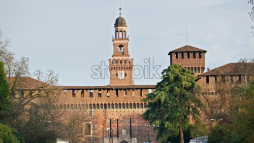 Milan, Italy – March 20, 2025: Distant view of the Sforzesco Castle in daylight - Starpik Stock