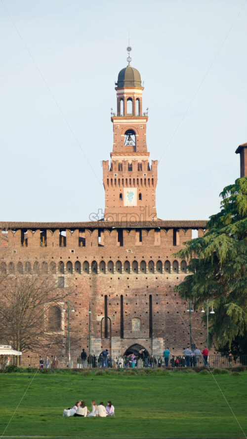 Milan, Italy – March 20, 2025: Distant view of the Sforzesco Castle in daylight. Vertical - Starpik Stock