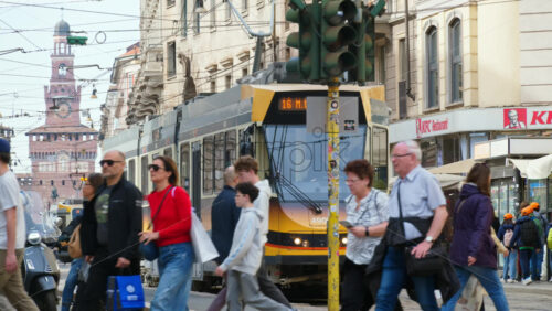 Milan, Italy – March 20, 2025: People walking on the streets of the city in daylight - Starpik Stock