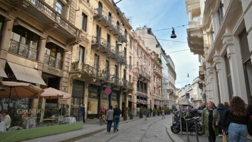 Milan, Italy – March 20, 2025: People walking on the streets of the city in daylight - Starpik Stock