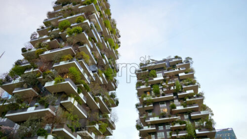 Milan, Italy – March 21, 2025: Low angle view of the Vertical Forest residential complex in the Porta Nuova district - Starpik Stock
