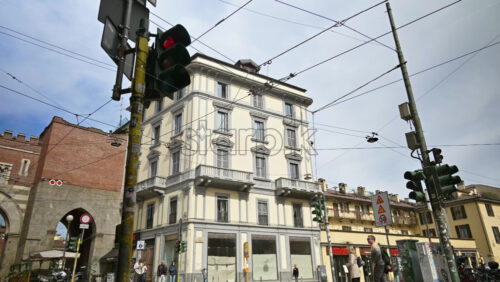 Milan, Italy – March 21, 2025: Time lapse of people, cars and public transportation moving on the streets of the city in daylight - Starpik Stock