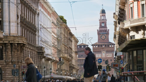 Milan, Italy – March 21, 2025: View of the Filarete Tower between buildings in Milan, Italy in daylight - Starpik Stock