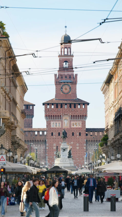 Milan, Italy – March 21, 2025: View of the Filarete Tower between buildings in Milan, Italy in daylight. Vertical - Starpik Stock