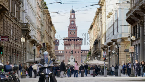Milan, Italy – March 21, 2025: View of the Filarete Tower between buildings in daylight - Starpik Stock