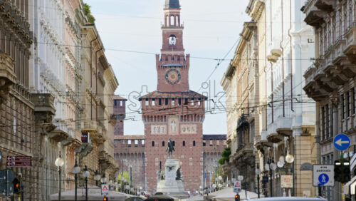 Milan, Italy – March 21, 2025: View of the Filarete Tower between buildings in daylight - Starpik Stock