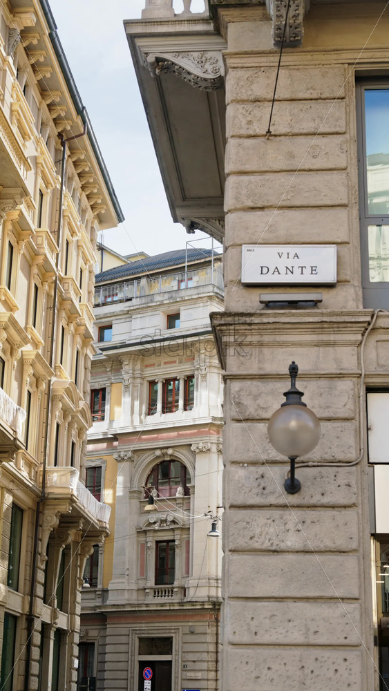 Milan, Italy – March 21, 2025: View of white buildings in the city in daylight. Vertical - Starpik Stock