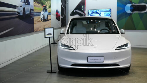 Milan, Italy – March 21, 2025: White Tesla Model 3 car displayed at the Showroom - Starpik Stock