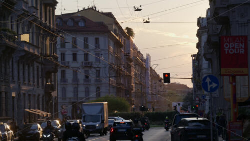 Milan, Italy – March 22, 2025: Cars moving on the streets of the city in the evening - Starpik Stock