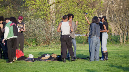Milan, Italy – March 23, 2025: People socialising in the park in daylight - Starpik Stock