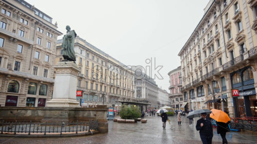 Milan, Italy – March 23, 2025: The monument to Giuseppe Parini bronze statue in the Cordusio Square - Starpik Stock